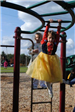 Young Princess Plays on Playground