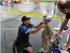Officer Assist Child With Helmet Latching