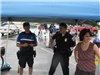 Officers and Community Member Stand Under Tent