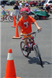 Child Stands on Bike While Going Through Course