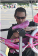 Employee Looks Over Pink Bikes