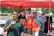 Home Depot Employees Smile for Camera with Child