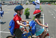 Multiple Children Wait on Bike for Course to Start
