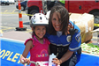 Officer Smiles Next to Child After Course