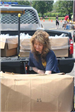 Volunteer Opens Box