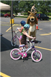 Young Children on Bike Watch Moose Mascot