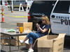 Woman Sits at Police Table