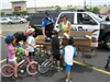 Children Wait in Line for Water Bottles
