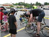 Volunteers Check Over Bike for Children