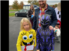Dog with two kids in costumes