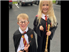 Two kids in Harry Potter costumes