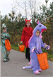 Children in Costumes Walk Near Forest Area