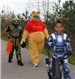 Family in Costume Walks Down Lane