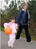 Girl and Mother Walk With Candy Bags