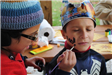 Volunteer Paints Boys Face