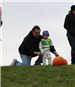Young Boy Prepares to Roll his Pumpkin