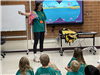 Safety Town Instructor Presenting to Students How to Put on Lifejacket on Day 4 of Safety Town 2025