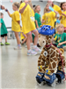 Roller Skating Giraffe Teaches Importance of Wearing Helmets to Safety Town Students on Day 2 of Safety Town 2025
