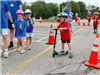 Safety Town Student Rides Scooter on Day 1 of Safety Town 2025