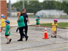 Safety Town Students Ride Scooter on Day 1 of Safety Town 2025