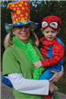 Mother Holds Boy in Costume