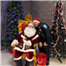 An officer stands next to a sitting Santa Claus, between 2 Christmas Trees