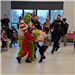 2 Children are seen trying to take a bag of toys from the grinch, in the back 2 cops are running 