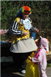Woman in Costume Gives Out Candy