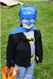 Young Batman Smiles for Camera