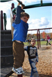 Young Boy Plays on Playground