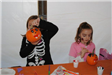 Young Children Paint Pumpkins