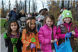 Young Children Wear Costumes as They Go Towards Candy