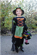 Young Girl in Witch Costume