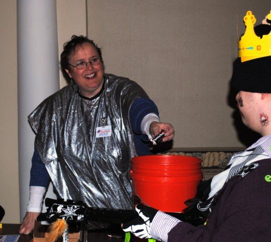 Volunteer Hands Out Candy