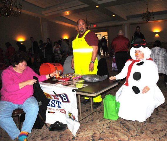 Volunteers Look at Camera While Helping