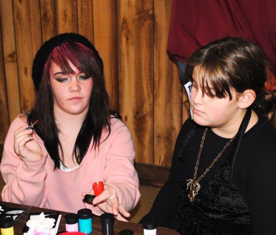 Woman Prepares to Paint a Face