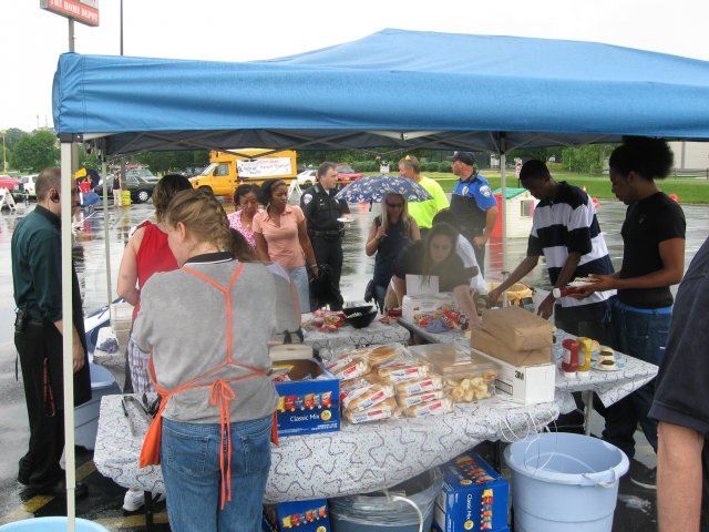 Community Members Go through the Food Line