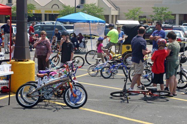 Young Bikers Line Up Bikes Near Tents