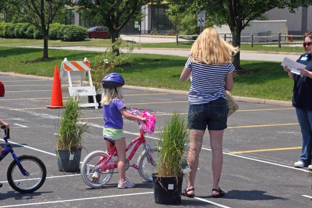 Young Girl Stops Bike During Course