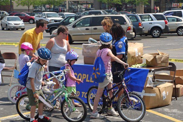 Young People Go Through Walmart Check in Table