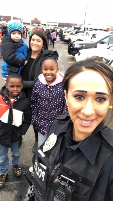 Officer Shendy with mother and children