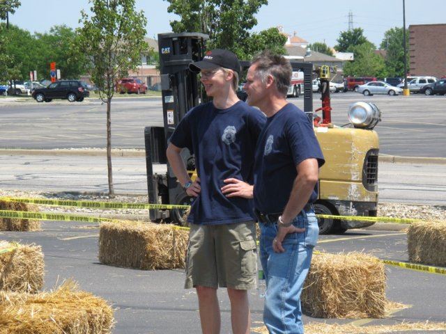 Volunteers Smile Next to Course