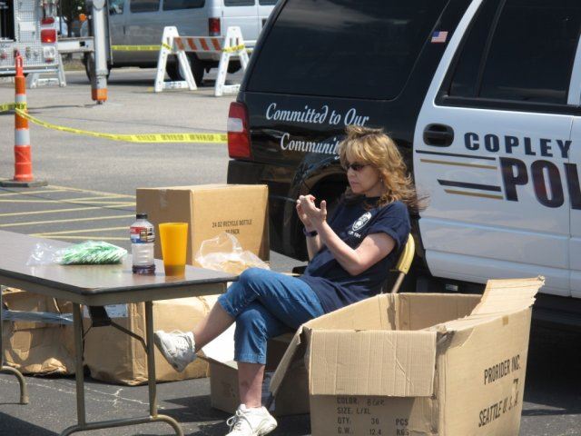 Woman Sits at Police Table