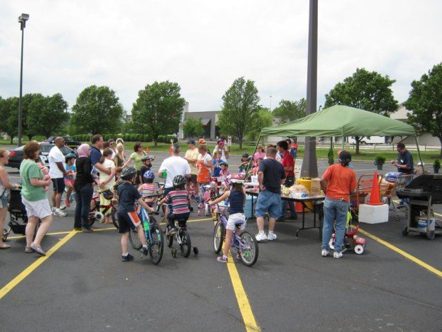 Volunteers Serve Food at Tent Area