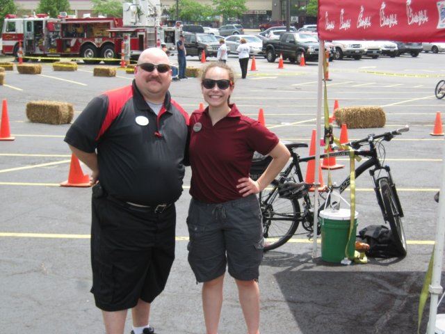 Volunteers Stand Next to Food Area