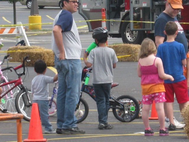 Young Riders Next to Hay Bale Section of Course