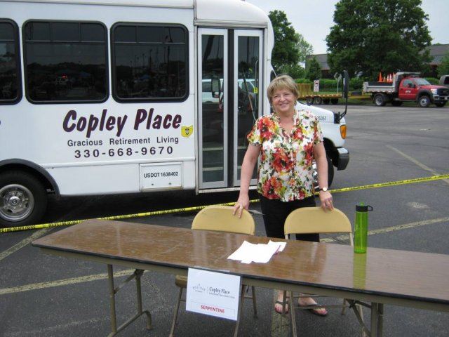 Woman Stand Near Table and Copley Place Bus