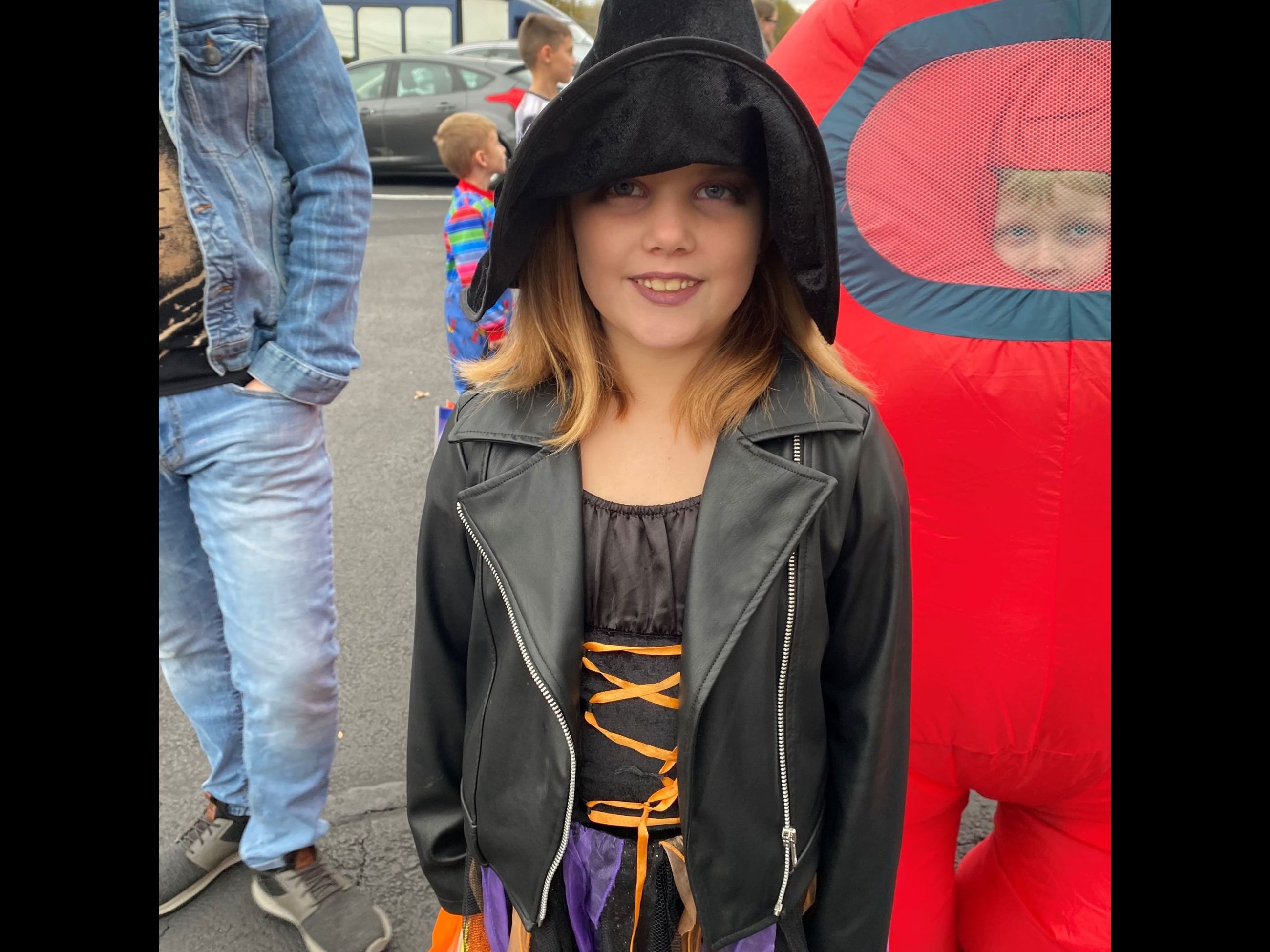 Young girl in witch costume
