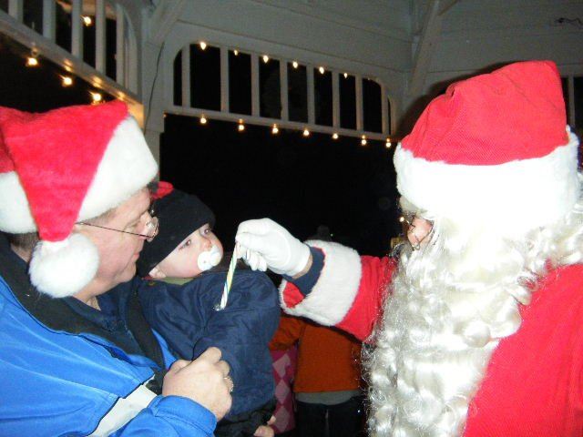 Santa Gives Candy to Baby