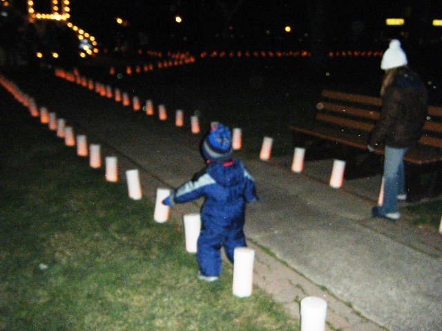 Young Child Runs Down Lane With Lights
